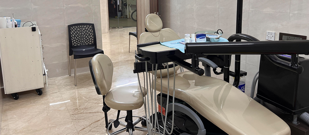 Modern dental chair and treatment room at Ray Dentistry Mogappair